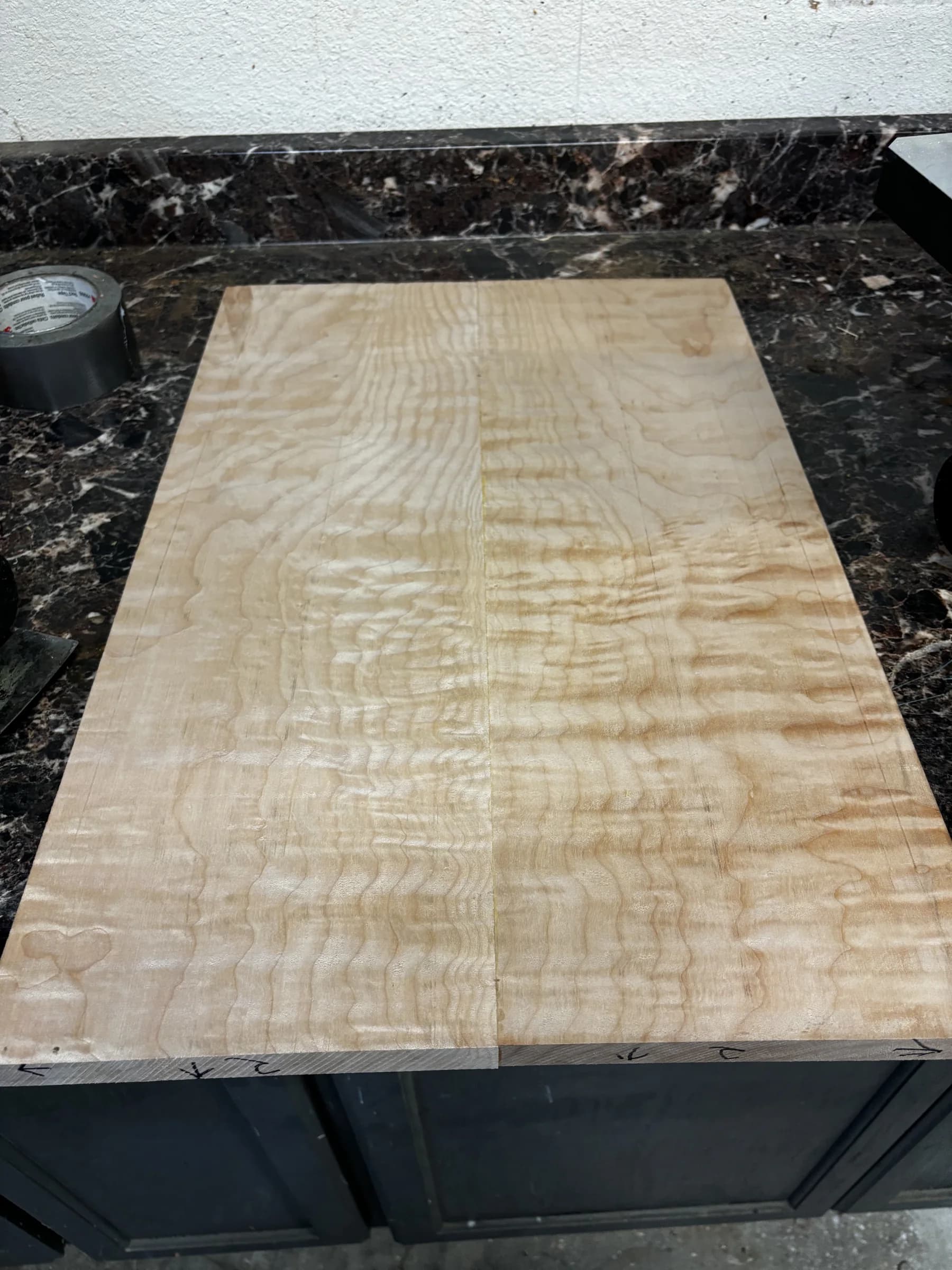Bookmatched figured wood on a workbench