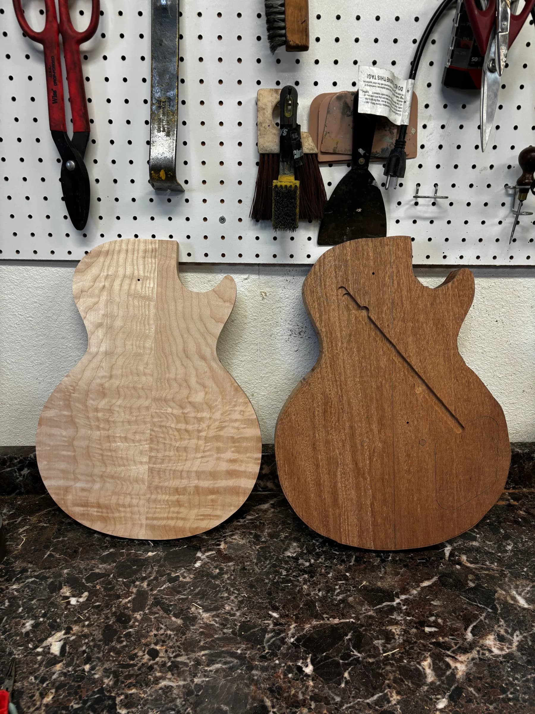 Figured top and chambered guitar body shown during the build