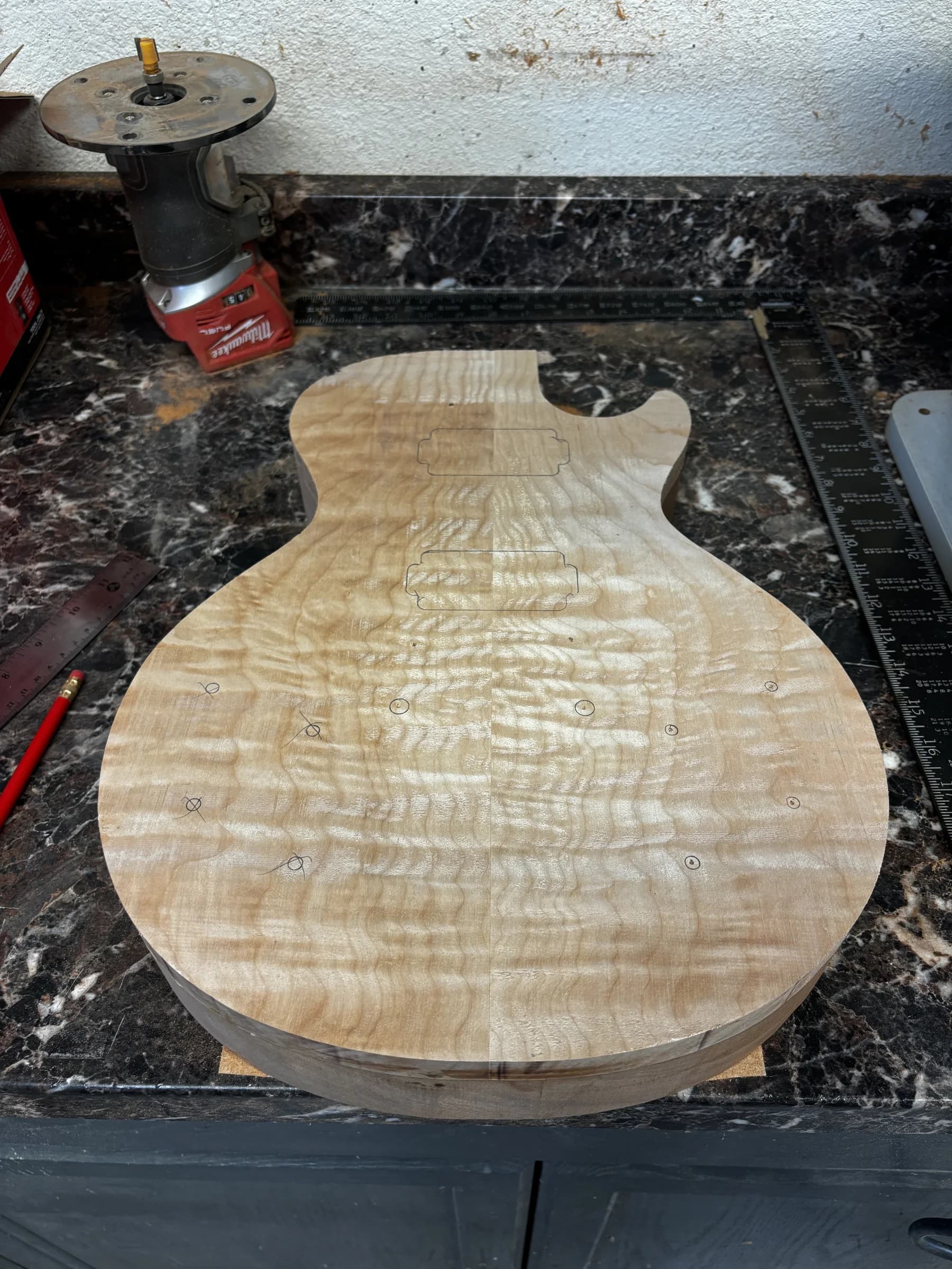 Early carved SJR guitar body shown in the workshop
