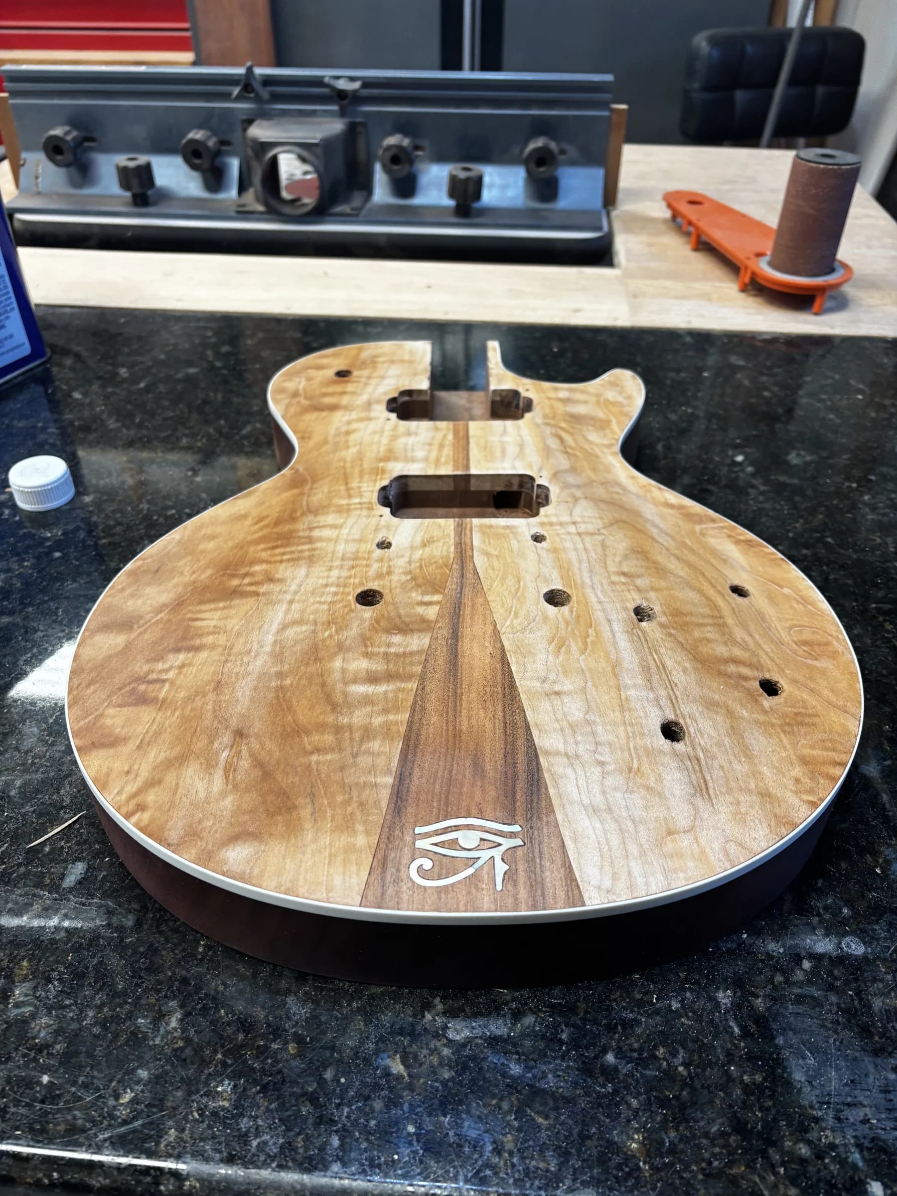 Unfinished bound SJR guitar body with a tapered center stripe