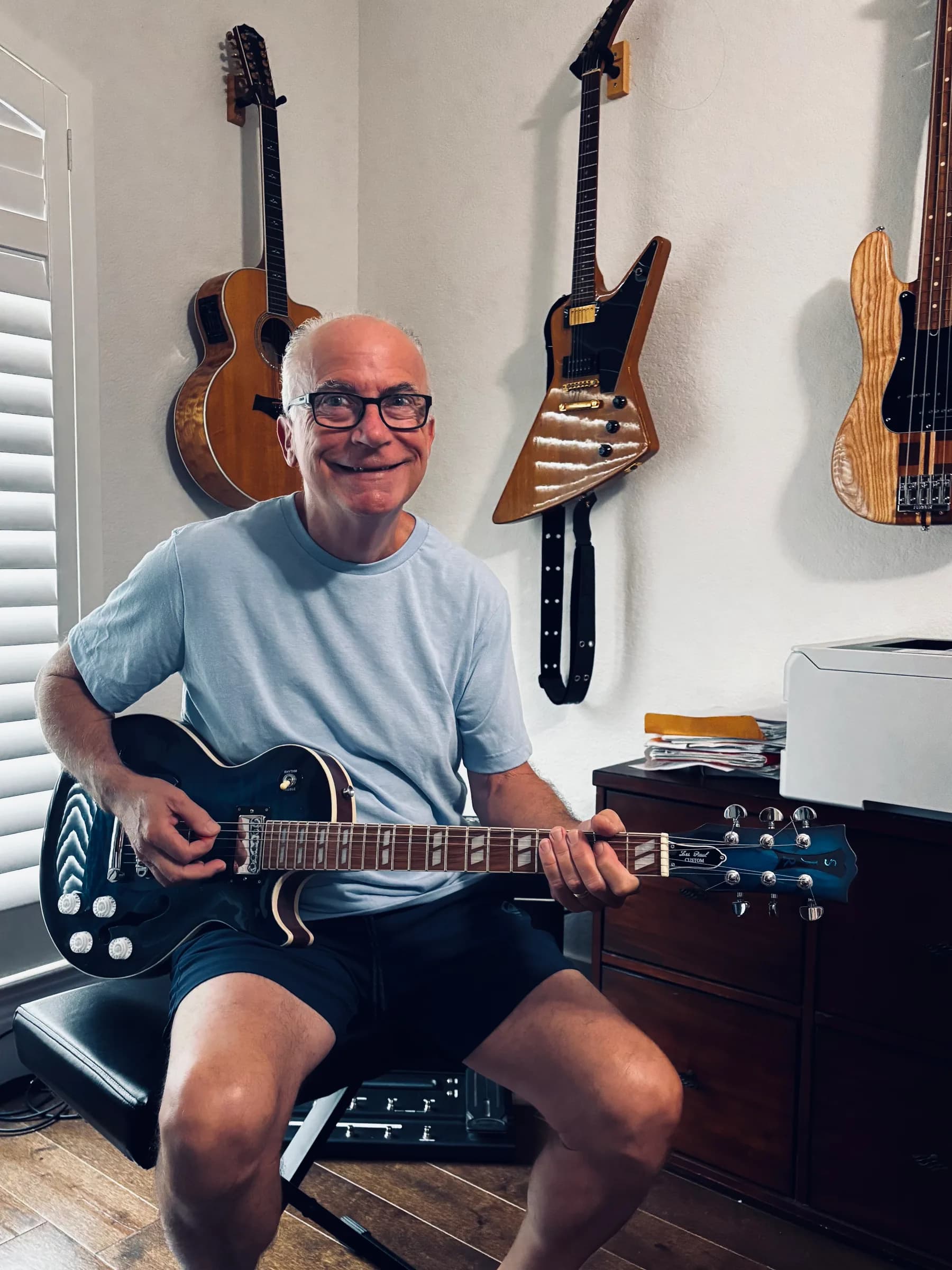 Steve of SJR Custom Guitars seated with an electric guitar