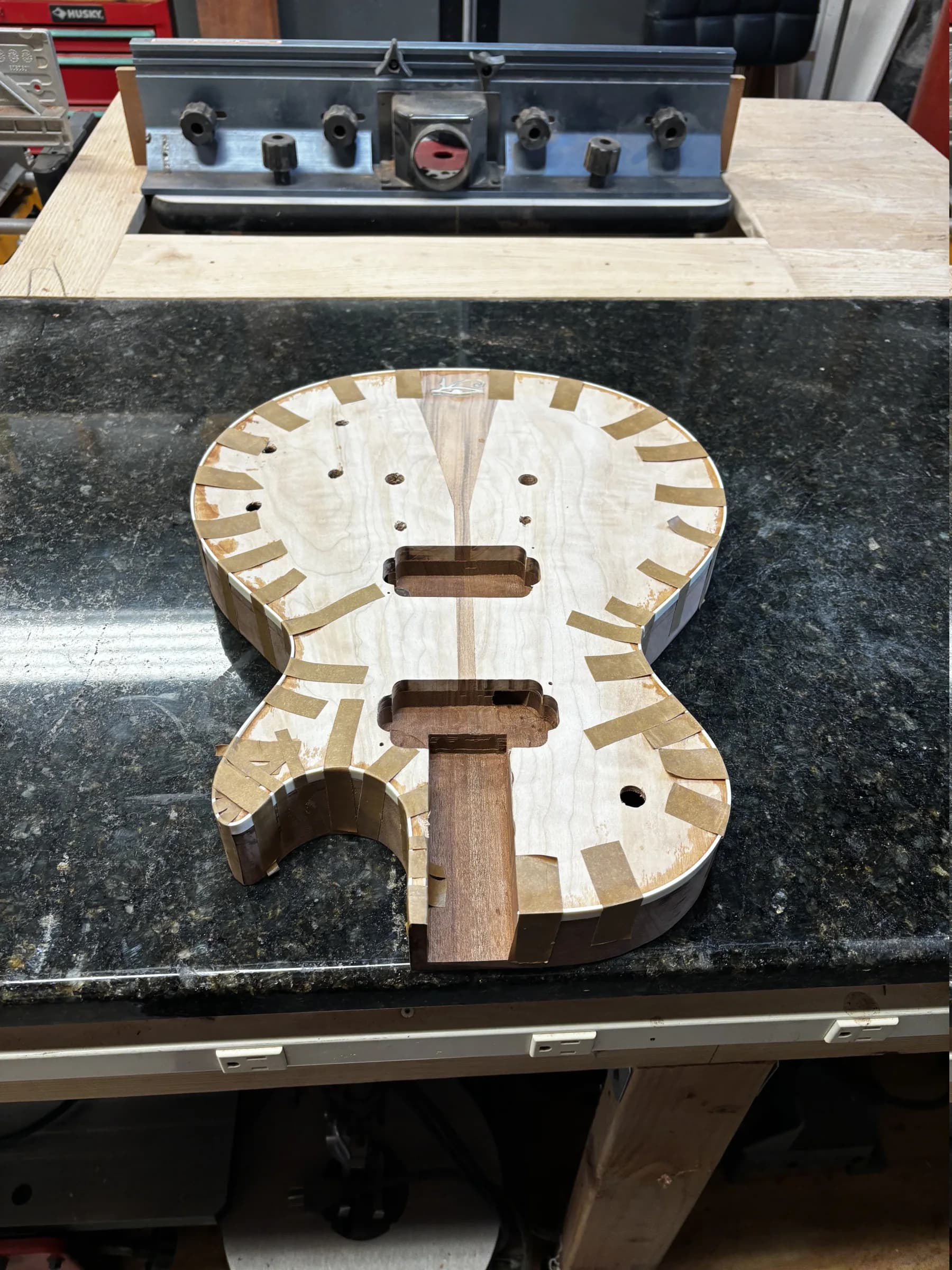 Bound single-cut guitar body shown during an in-progress finish stage